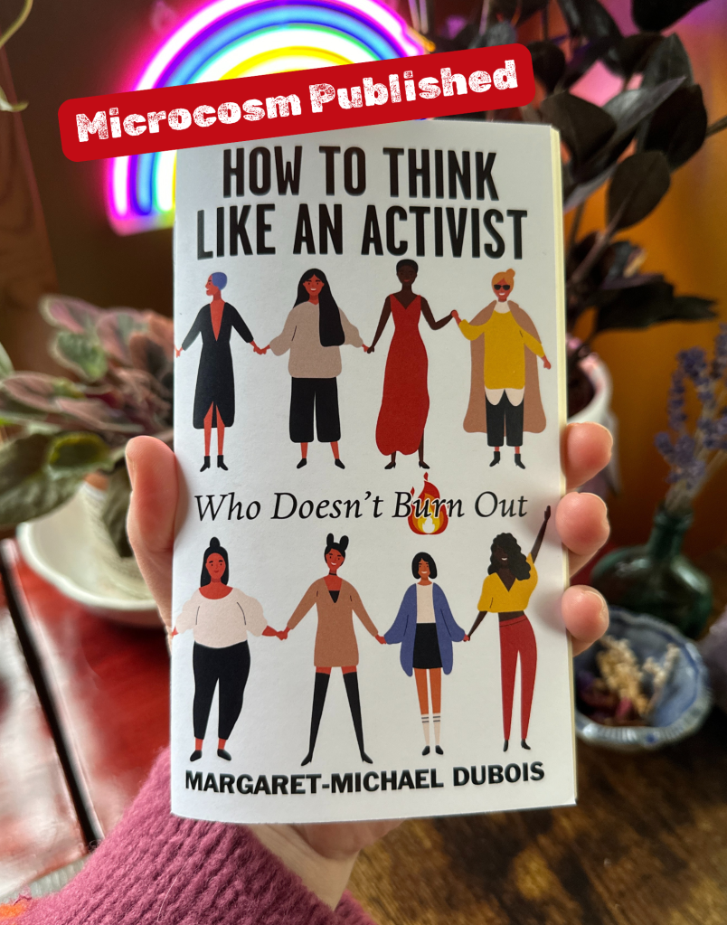 A hand holds a zine in front of some plants. The zine cover says how to think like an activist who doesn't burn out